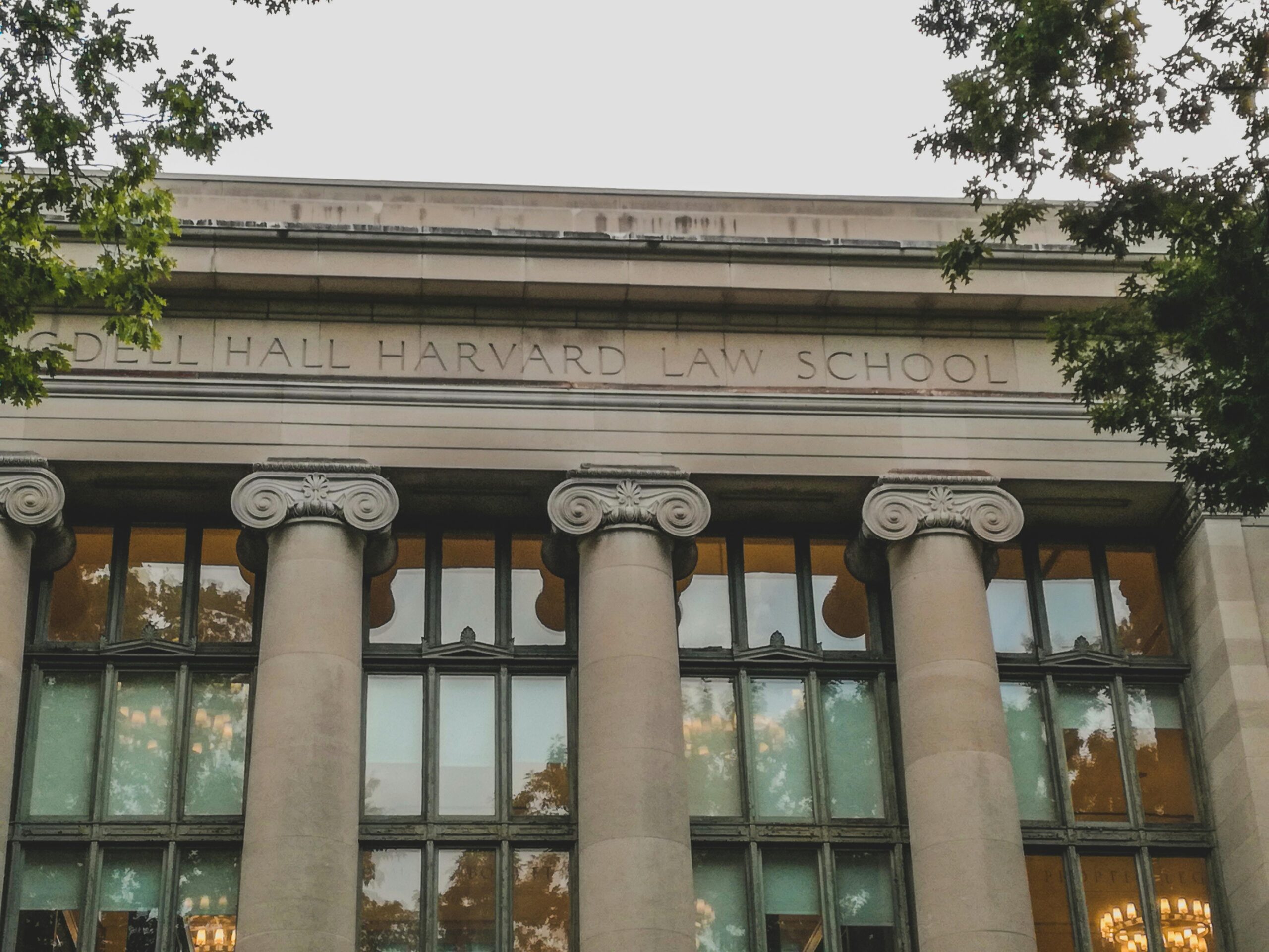 Classical architecture of Harvard Law School's facade with iconic columns, perfect for educational themes.